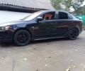 Чорний Міцубісі Lancer, об'ємом двигуна 2 л та пробігом 260 тис. км за 7000 $, фото 1 на Automoto.ua
