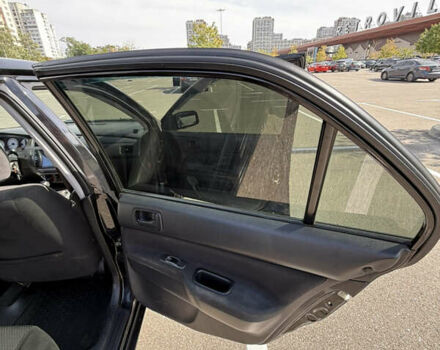 Черный Мицубиси Лансер, объемом двигателя 1.6 л и пробегом 321 тыс. км за 5000 $, фото 34 на Automoto.ua