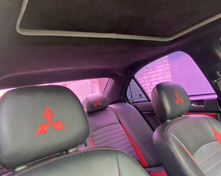 Черный Мицубиси Лансер, объемом двигателя 2 л и пробегом 275 тыс. км за 7700 $, фото 5 на Automoto.ua