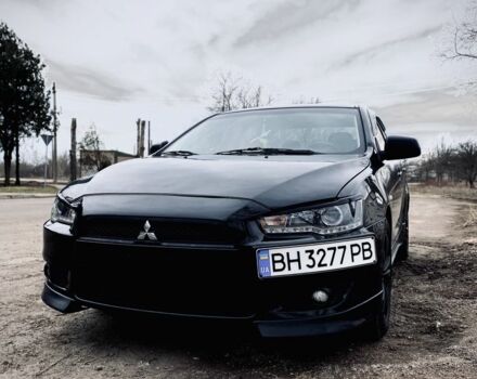 Черный Мицубиси Лансер, объемом двигателя 2 л и пробегом 140 тыс. км за 7200 $, фото 1 на Automoto.ua