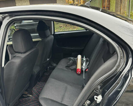 Черный Мицубиси Лансер, объемом двигателя 1.5 л и пробегом 278 тыс. км за 4200 $, фото 10 на Automoto.ua