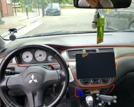 Чорний Міцубісі Lancer, об'ємом двигуна 1.58 л та пробігом 334 тис. км за 4750 $, фото 3 на Automoto.ua