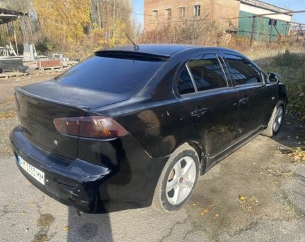 Черный Мицубиси Лансер, объемом двигателя 2 л и пробегом 190 тыс. км за 3100 $, фото 1 на Automoto.ua