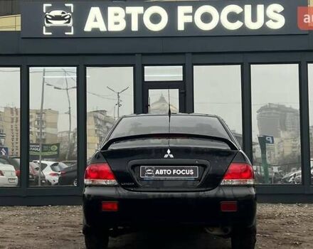 Чорний Міцубісі Lancer, об'ємом двигуна 1.6 л та пробігом 340 тис. км за 6190 $, фото 6 на Automoto.ua