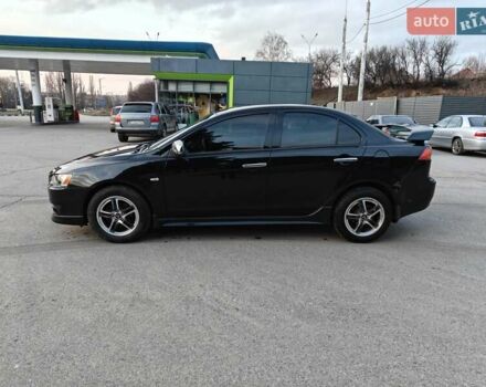 Черный Мицубиси Лансер, объемом двигателя 2 л и пробегом 245 тыс. км за 5600 $, фото 1 на Automoto.ua