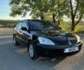 Чорний Міцубісі Lancer, об'ємом двигуна 1.58 л та пробігом 203 тис. км за 5100 $, фото 1 на Automoto.ua