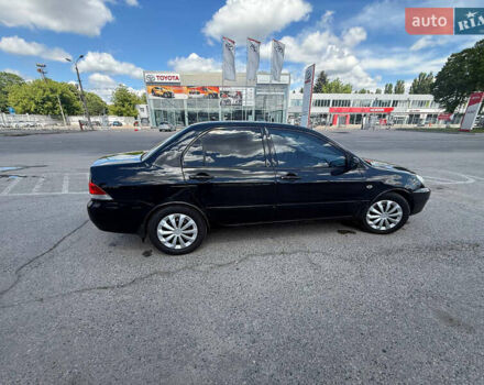 Чорний Міцубісі Lancer, об'ємом двигуна 1.6 л та пробігом 292 тис. км за 3600 $, фото 7 на Automoto.ua