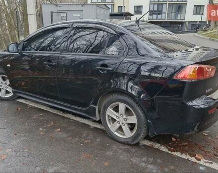 Чорний Міцубісі Lancer, об'ємом двигуна 2 л та пробігом 302 тис. км за 7200 $, фото 2 на Automoto.ua