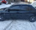 Черный Мицубиси Лансер, объемом двигателя 1.6 л и пробегом 166 тыс. км за 5500 $, фото 1 на Automoto.ua