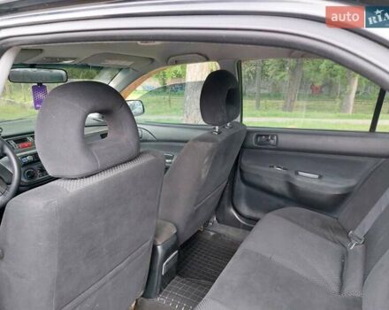 Чорний Міцубісі Lancer, об'ємом двигуна 1.6 л та пробігом 215 тис. км за 4900 $, фото 14 на Automoto.ua
