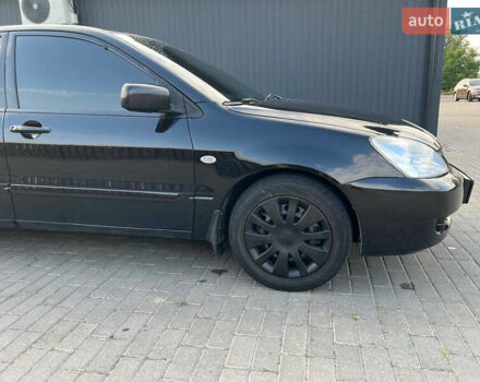Чорний Міцубісі Lancer, об'ємом двигуна 1.58 л та пробігом 237 тис. км за 4500 $, фото 10 на Automoto.ua