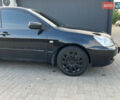Чорний Міцубісі Lancer, об'ємом двигуна 1.58 л та пробігом 237 тис. км за 4500 $, фото 10 на Automoto.ua