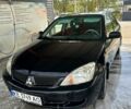 Черный Мицубиси Лансер, объемом двигателя 1.6 л и пробегом 271 тыс. км за 3450 $, фото 1 на Automoto.ua