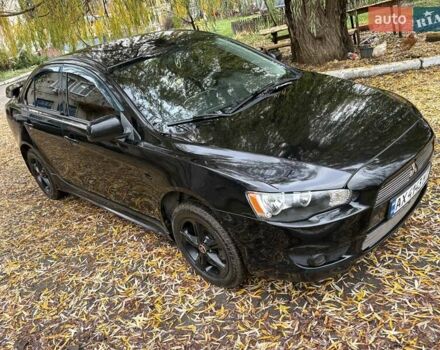 Черный Мицубиси Лансер, объемом двигателя 2 л и пробегом 260 тыс. км за 6100 $, фото 1 на Automoto.ua