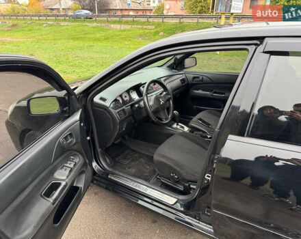 Чорний Міцубісі Lancer, об'ємом двигуна 1.6 л та пробігом 200 тис. км за 4500 $, фото 1 на Automoto.ua
