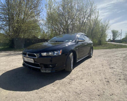 Чорний Міцубісі Lancer, об'ємом двигуна 2 л та пробігом 237 тис. км за 7599 $, фото 1 на Automoto.ua