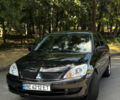 Черный Мицубиси Лансер, объемом двигателя 1.58 л и пробегом 170 тыс. км за 4999 $, фото 1 на Automoto.ua