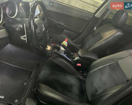 Черный Мицубиси Лансер, объемом двигателя 2 л и пробегом 200 тыс. км за 8000 $, фото 5 на Automoto.ua