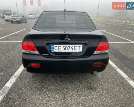 Черный Мицубиси Лансер, объемом двигателя 1.58 л и пробегом 214 тыс. км за 4400 $, фото 10 на Automoto.ua