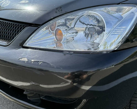 Черный Мицубиси Лансер, объемом двигателя 1.6 л и пробегом 321 тыс. км за 5000 $, фото 8 на Automoto.ua