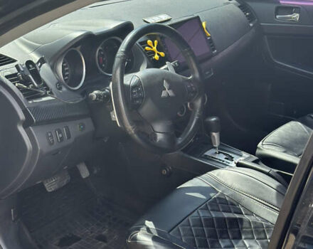 Черный Мицубиси Лансер, объемом двигателя 2 л и пробегом 295 тыс. км за 7000 $, фото 6 на Automoto.ua