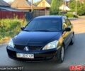 Черный Мицубиси Лансер, объемом двигателя 1.6 л и пробегом 220 тыс. км за 3750 $, фото 1 на Automoto.ua