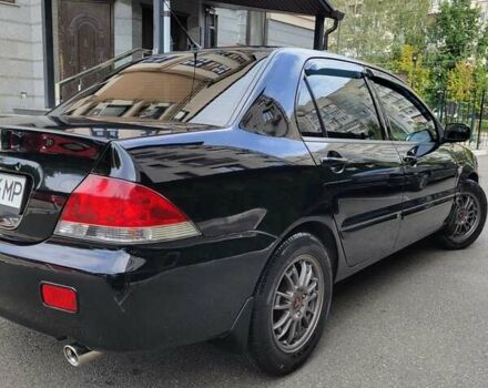 Чорний Міцубісі Lancer, об'ємом двигуна 1.58 л та пробігом 334 тис. км за 4750 $, фото 9 на Automoto.ua