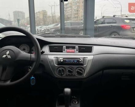 Чорний Міцубісі Lancer, об'ємом двигуна 1.6 л та пробігом 340 тис. км за 6190 $, фото 12 на Automoto.ua