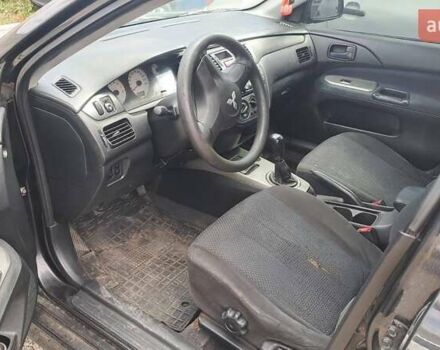 Черный Мицубиси Лансер, объемом двигателя 1.58 л и пробегом 316 тыс. км за 2200 $, фото 4 на Automoto.ua