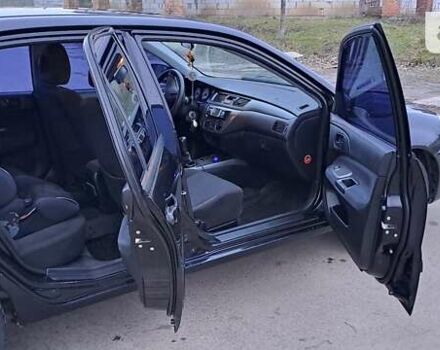 Чорний Міцубісі Lancer, об'ємом двигуна 1.6 л та пробігом 131 тис. км за 6000 $, фото 9 на Automoto.ua