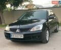 Чорний Міцубісі Lancer, об'ємом двигуна 1.58 л та пробігом 272 тис. км за 3999 $, фото 1 на Automoto.ua