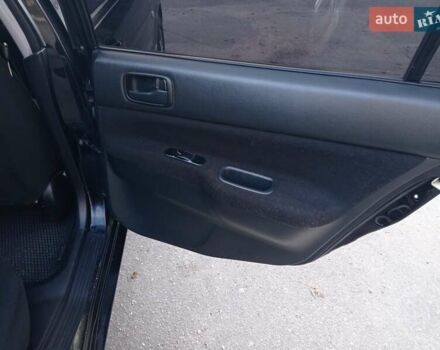 Чорний Міцубісі Lancer, об'ємом двигуна 1.58 л та пробігом 286 тис. км за 4950 $, фото 15 на Automoto.ua