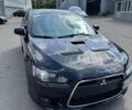Черный Мицубиси Лансер, объемом двигателя 2 л и пробегом 145 тыс. км за 12000 $, фото 1 на Automoto.ua
