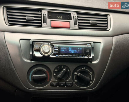 Чорний Міцубісі Lancer, об'ємом двигуна 1.6 л та пробігом 265 тис. км за 4700 $, фото 20 на Automoto.ua