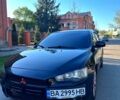 Черный Мицубиси Лансер, объемом двигателя 2 л и пробегом 323 тыс. км за 5700 $, фото 1 на Automoto.ua