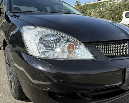 Черный Мицубиси Лансер, объемом двигателя 1.6 л и пробегом 321 тыс. км за 5000 $, фото 10 на Automoto.ua