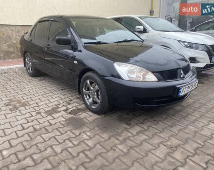 Черный Мицубиси Лансер, объемом двигателя 1.58 л и пробегом 211 тыс. км за 6333 $, фото 19 на Automoto.ua