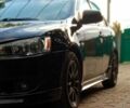 Чорний Міцубісі Lancer, об'ємом двигуна 2 л та пробігом 213 тис. км за 6200 $, фото 1 на Automoto.ua