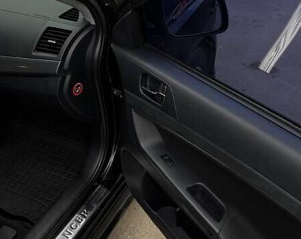 Черный Мицубиси Лансер, объемом двигателя 2 л и пробегом 222 тыс. км за 6000 $, фото 4 на Automoto.ua