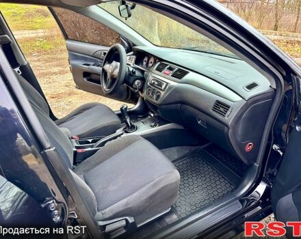 Черный Мицубиси Лансер, объемом двигателя 1.6 л и пробегом 216 тыс. км за 5190 $, фото 11 на Automoto.ua