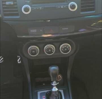 Чорний Міцубісі Lancer, об'ємом двигуна 2 л та пробігом 134 тис. км за 29034 $, фото 6 на Automoto.ua