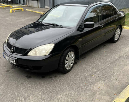 Чорний Міцубісі Lancer, об'ємом двигуна 1.58 л та пробігом 192 тис. км за 4500 $, фото 5 на Automoto.ua