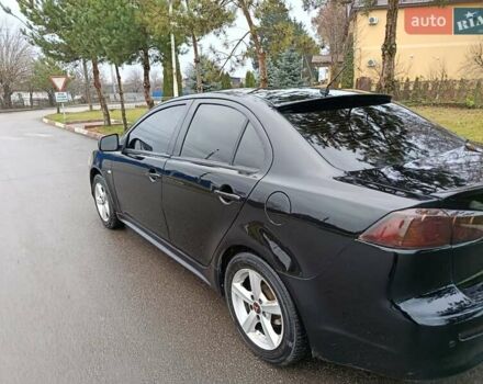 Черный Мицубиси Лансер, объемом двигателя 2 л и пробегом 200 тыс. км за 5100 $, фото 14 на Automoto.ua