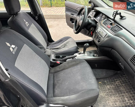 Чорний Міцубісі Lancer, об'ємом двигуна 1.58 л та пробігом 388 тис. км за 2300 $, фото 11 на Automoto.ua