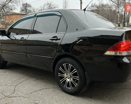Чорний Міцубісі Lancer, об'ємом двигуна 1.58 л та пробігом 167 тис. км за 4800 $, фото 2 на Automoto.ua