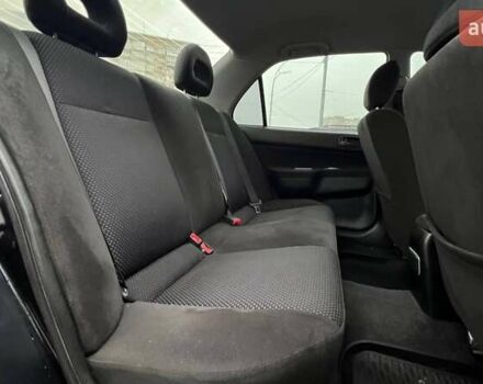 Чорний Міцубісі Lancer, об'ємом двигуна 1.6 л та пробігом 340 тис. км за 6190 $, фото 10 на Automoto.ua