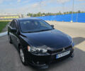 Чорний Міцубісі Lancer, об'ємом двигуна 2 л та пробігом 249 тис. км за 6500 $, фото 1 на Automoto.ua