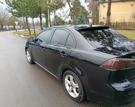 Черный Мицубиси Лансер, объемом двигателя 2 л и пробегом 200 тыс. км за 5100 $, фото 5 на Automoto.ua