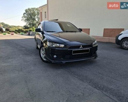 Черный Мицубиси Лансер, объемом двигателя 2 л и пробегом 230 тыс. км за 7000 $, фото 19 на Automoto.ua