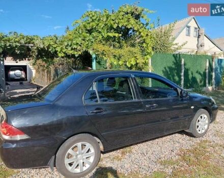 Чорний Міцубісі Lancer, об'ємом двигуна 1.6 л та пробігом 221 тис. км за 5200 $, фото 7 на Automoto.ua